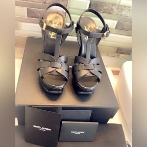 Saint Laurent patent leather Tribute sandal; golden hardware.